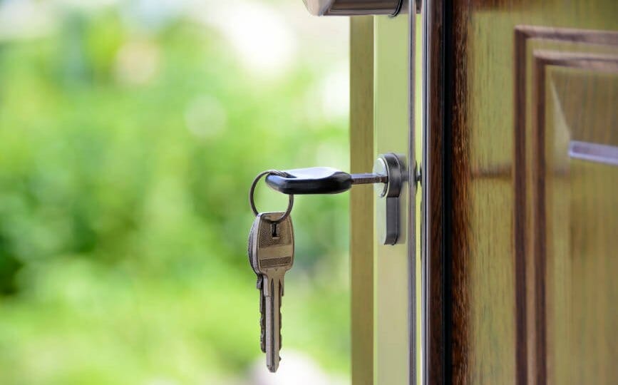 Keys and lock the door on the background of solar garden